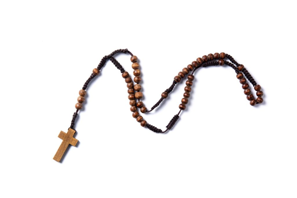 A rosary on a white background.