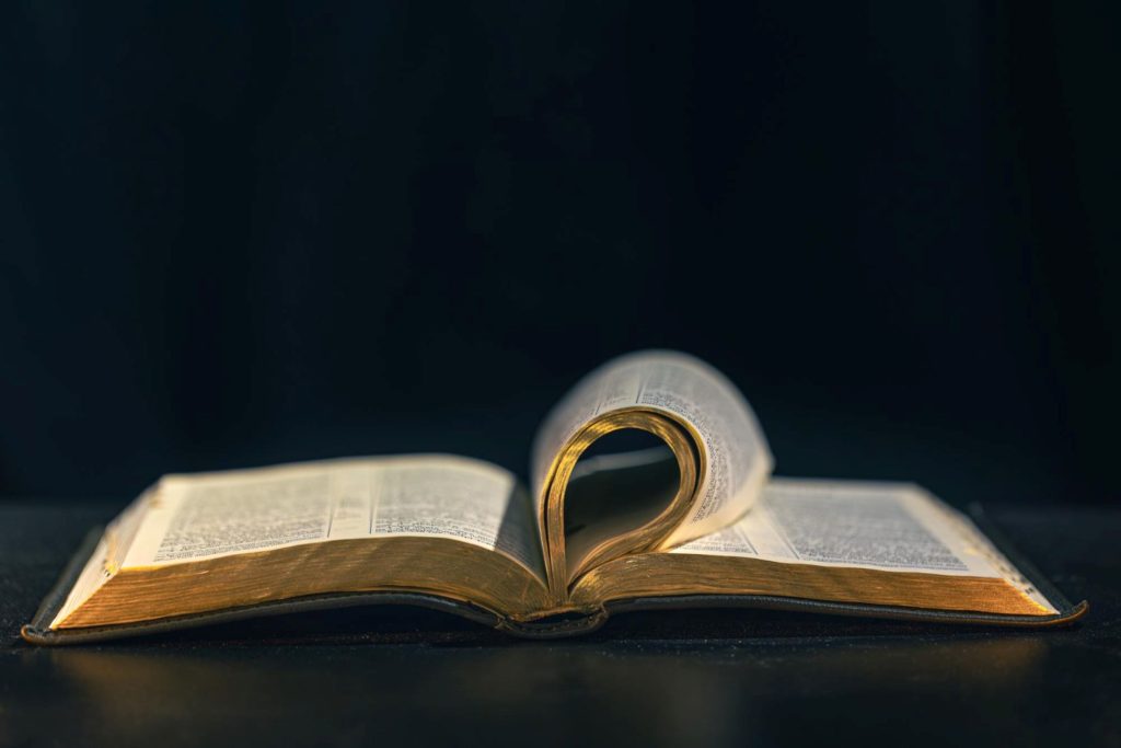 A Bible whose pages are curled inward.