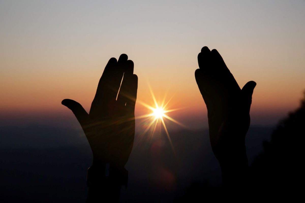Each step on the path to Christ is part of the key practices that transform. Hands held out to frame the rising sun.