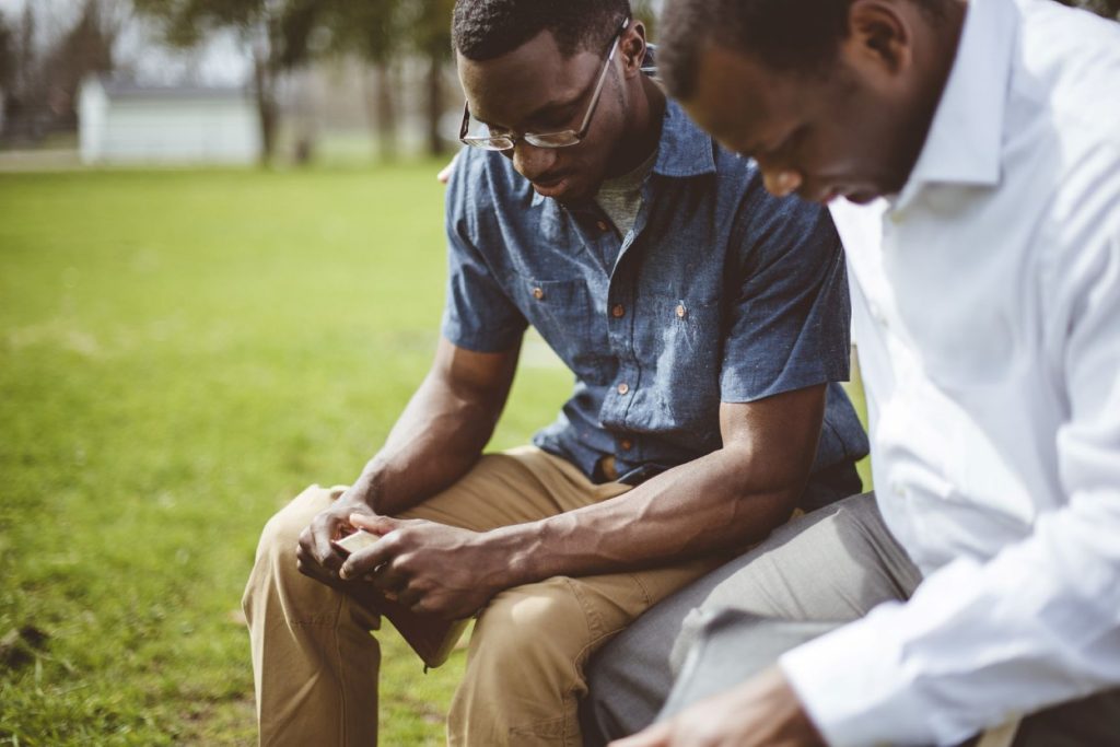 Two Black men reflecting on the heart of Jesus Christ.