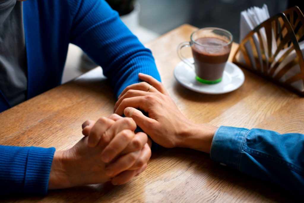 A hand offering forgiveness.